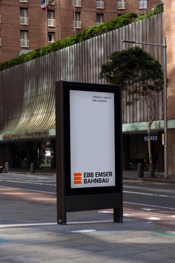 EBB Emser Bahnbau poster on a city street display